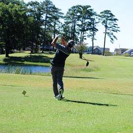 Golfer Teeing Off