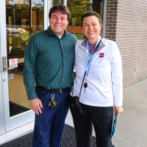 President Schnell and Mebane Rash in front of Johnson Building