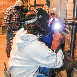 Student practicing welding techniques