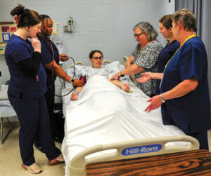 Healthcare students treating a patient