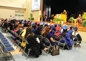 Grads and guests inside Delamar auditorium