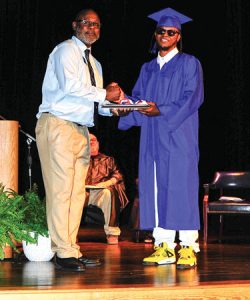 VP Jamie Gibbs and student DeLante Grant