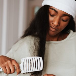 Woman combing her hair